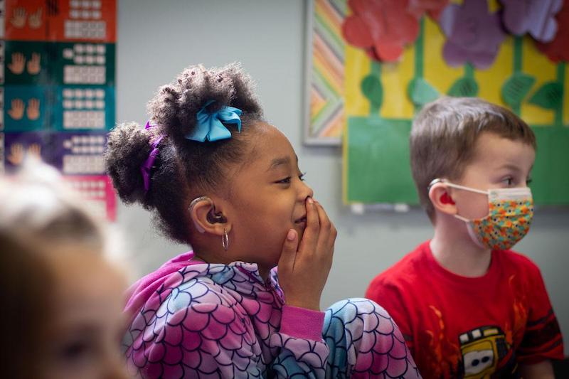 photo of children wearing hearing aids